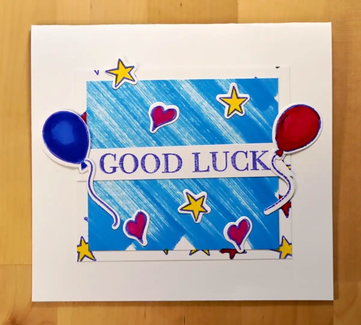 A pop-up card featuring balloons and stars, bringing good luck.