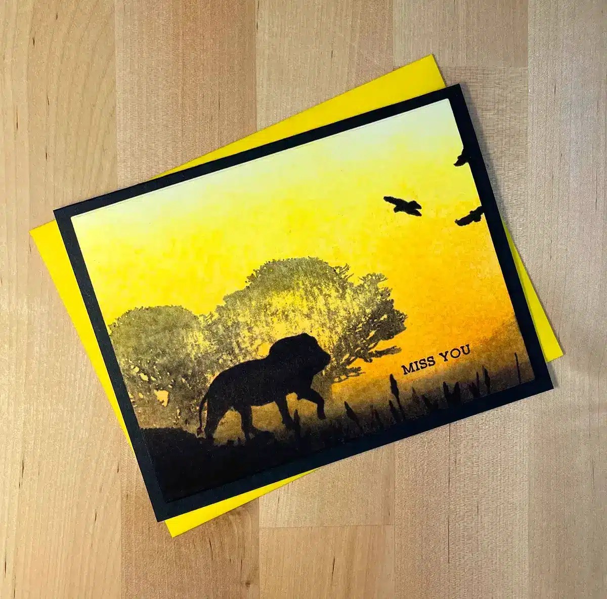 A DIY thank you card with a lion in the background.