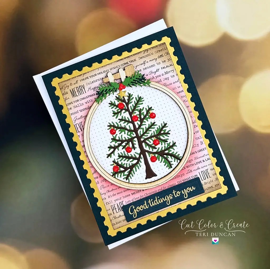 Christmas card depicting an ornament with an embroidered Christmas tree with red ornaments...but it's not stitched. Created using Spellbinders Nichol's Needlework Collection.