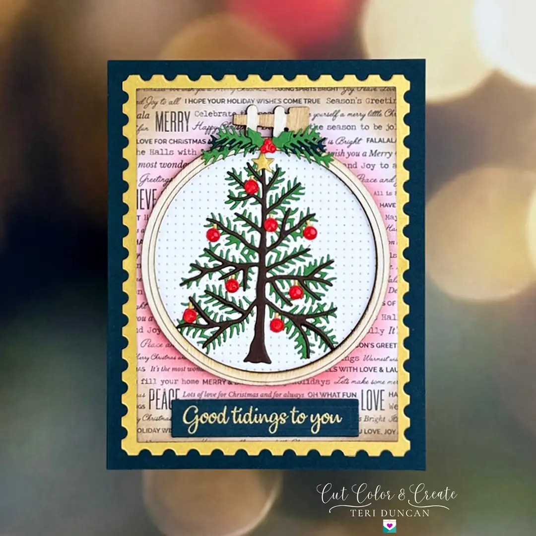 Christmas card depicting an ornament with an embroidered Christmas tree with red ornaments...but it's not stitched. Created using Spellbinders Nichol's Needlework Collection.