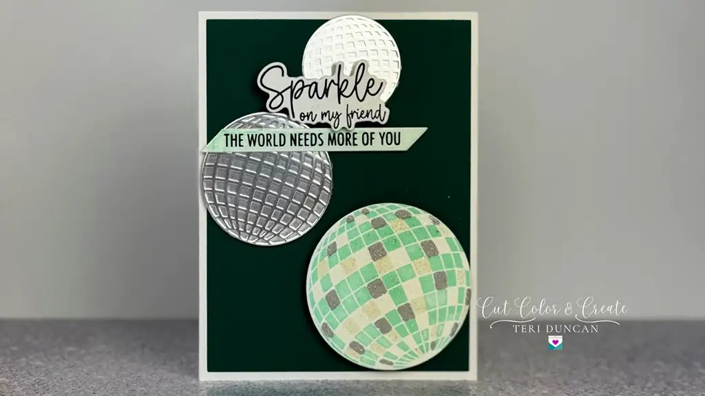 Beautiful greeting card featuring glittery disco balls that has the sentiment "Sparkle on my friend. This card is made with products from Spellbinders Shine Bright Collection.