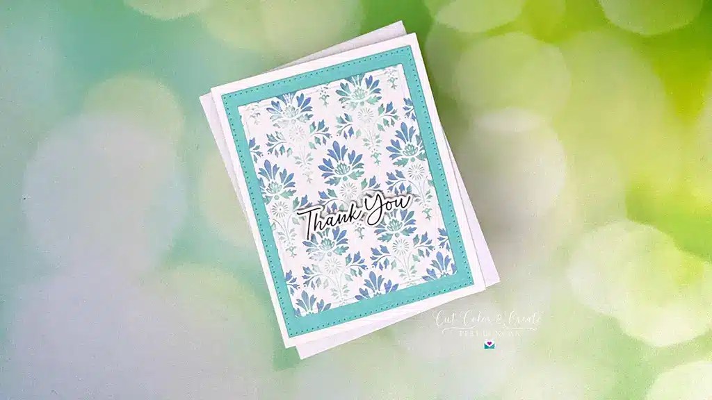 A thank you card featuring a spellbinding blue floral pattern on a softly blurred green background, perfect for the Spring Release collection.