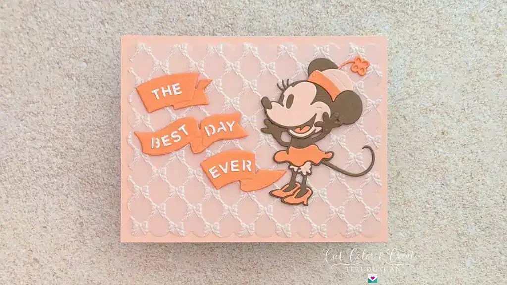 A handmade Darling Mouse Card features a cartoon mouse in an orange outfit beside three orange banners reading “THE BEST DAY EVER” against a patterned background.