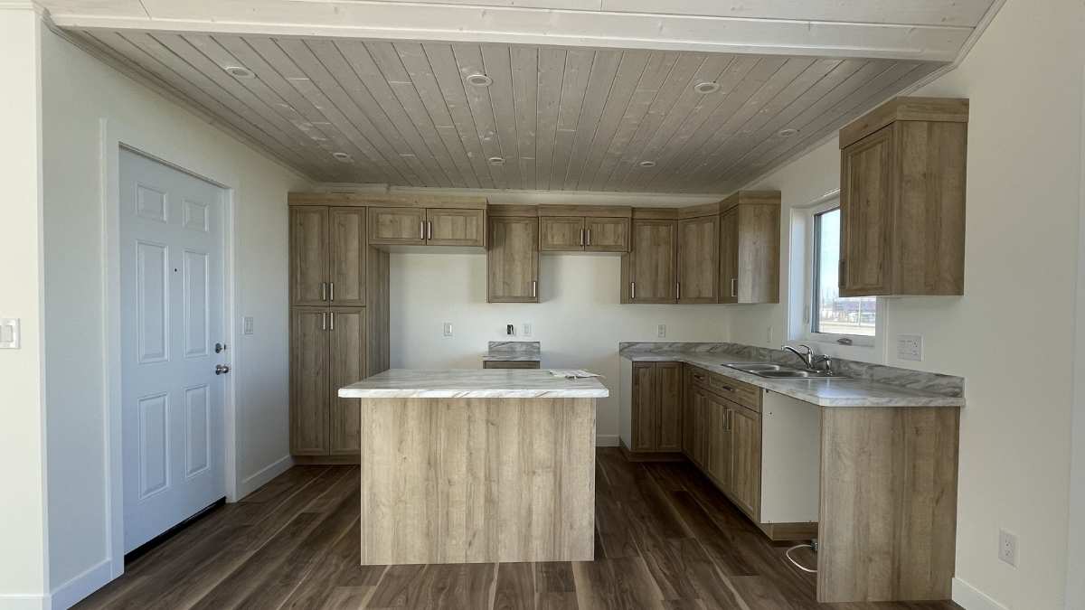 A kitchen with light brown NEXGEN cabinet doors. Every supplier has different standards for NEXGEN doors.
