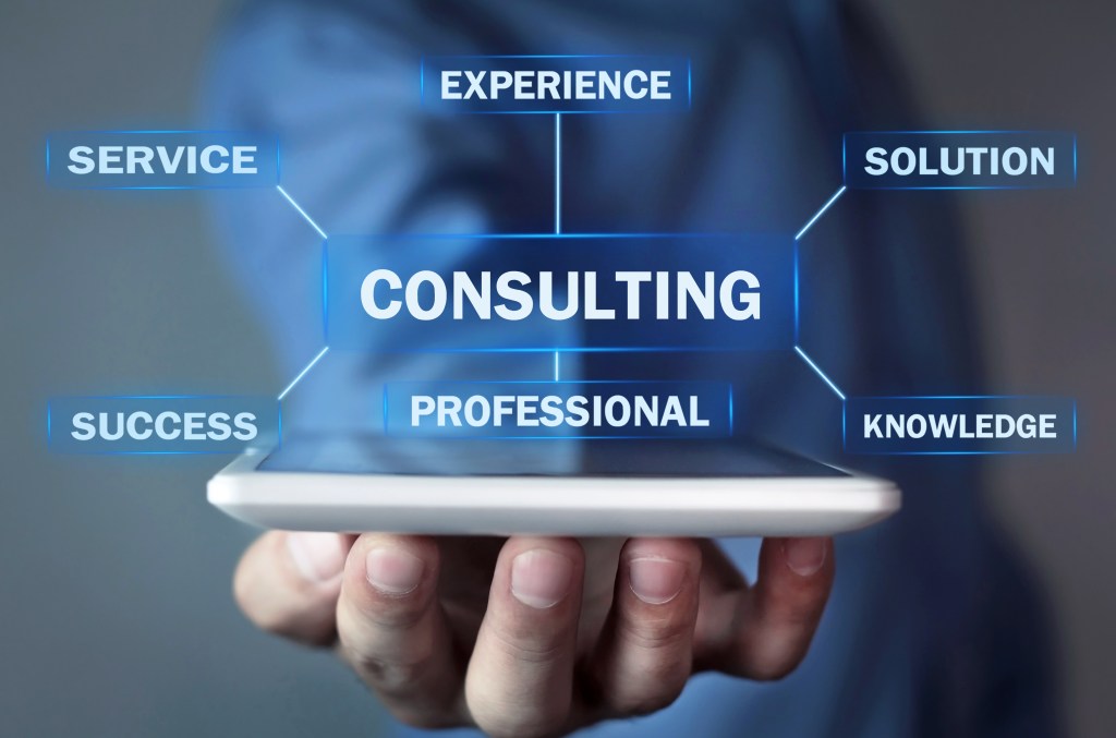 Man holding tablet with Consulting text. Business concept – Cyber Tips Guide