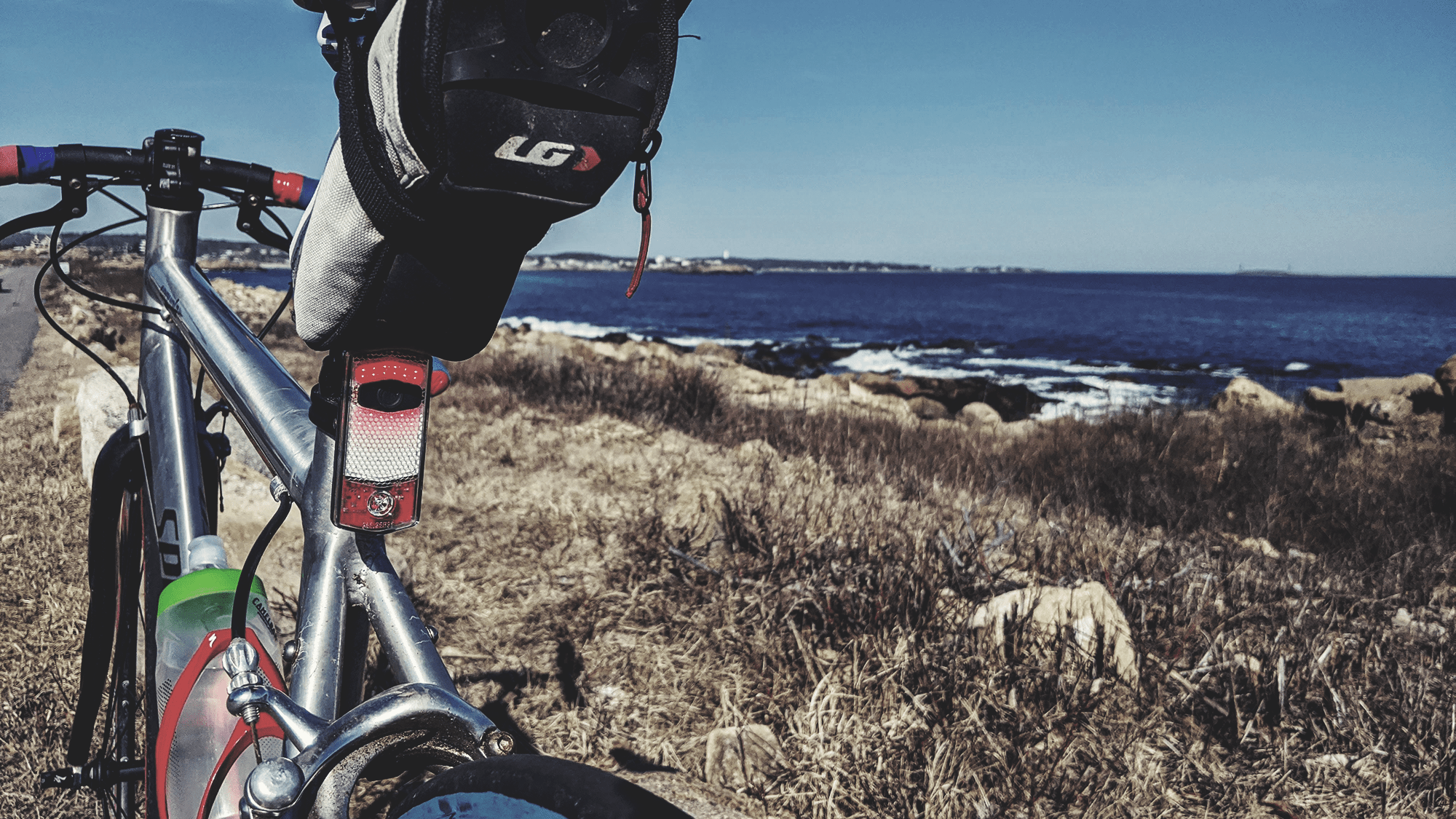 The See.Sense Icon 2 by the sea, mounted beneath a saddlebag.