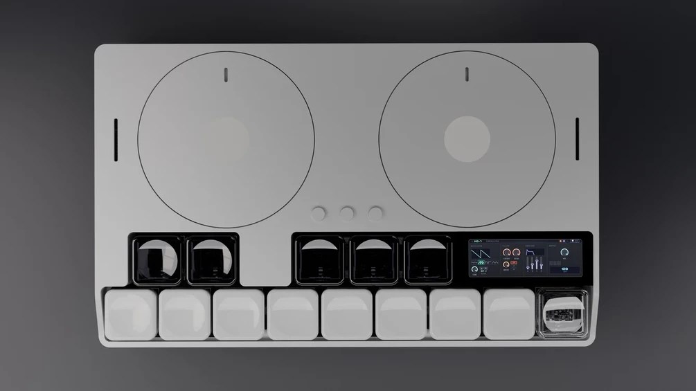Mach Devices MD-7 pocket synthesizer with two motorised haptic discs and a 13-key backlit keyboard.