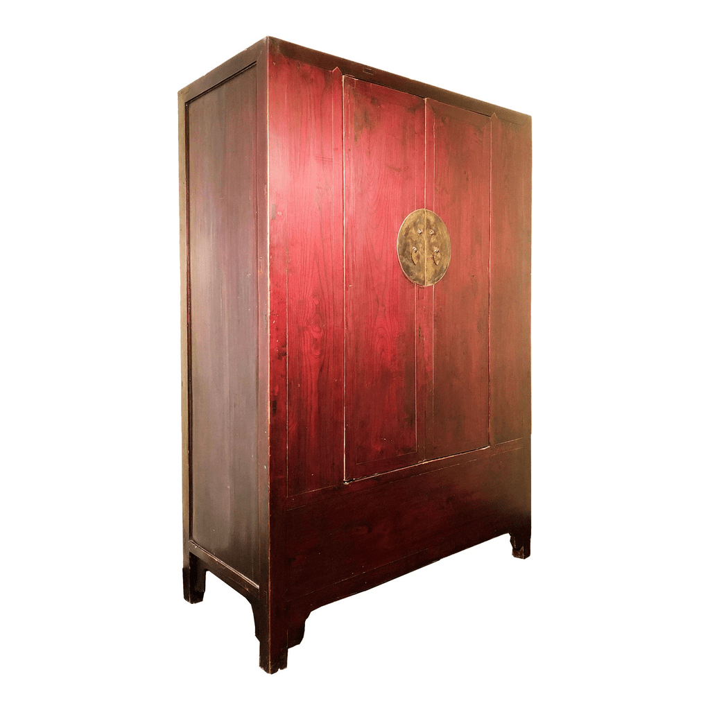 Red wooden armoire with classic round handles