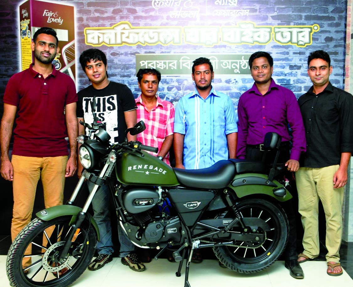 Sport bike prize Winners pose with a bike as Fair & Lovely Max Fairness organized a countrywide promotional campaign "Confidence Jar Bike Tar"" competition in the city on Monday."