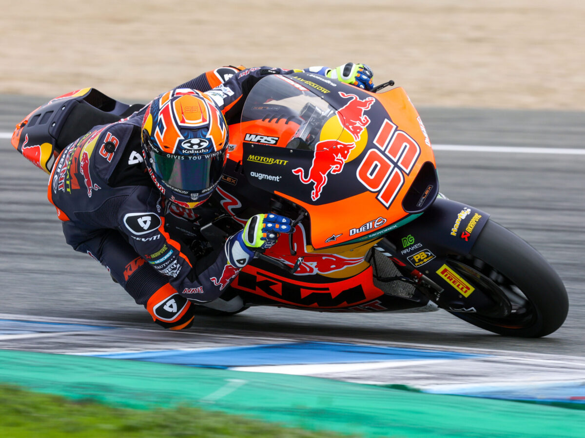 a man riding a motorcycle on a track