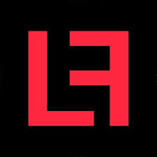 Daisy Khan delivering a speech from a podium, addressing an audience on inclusion, interfaith dialogue, and efforts to combat Islamophobia.