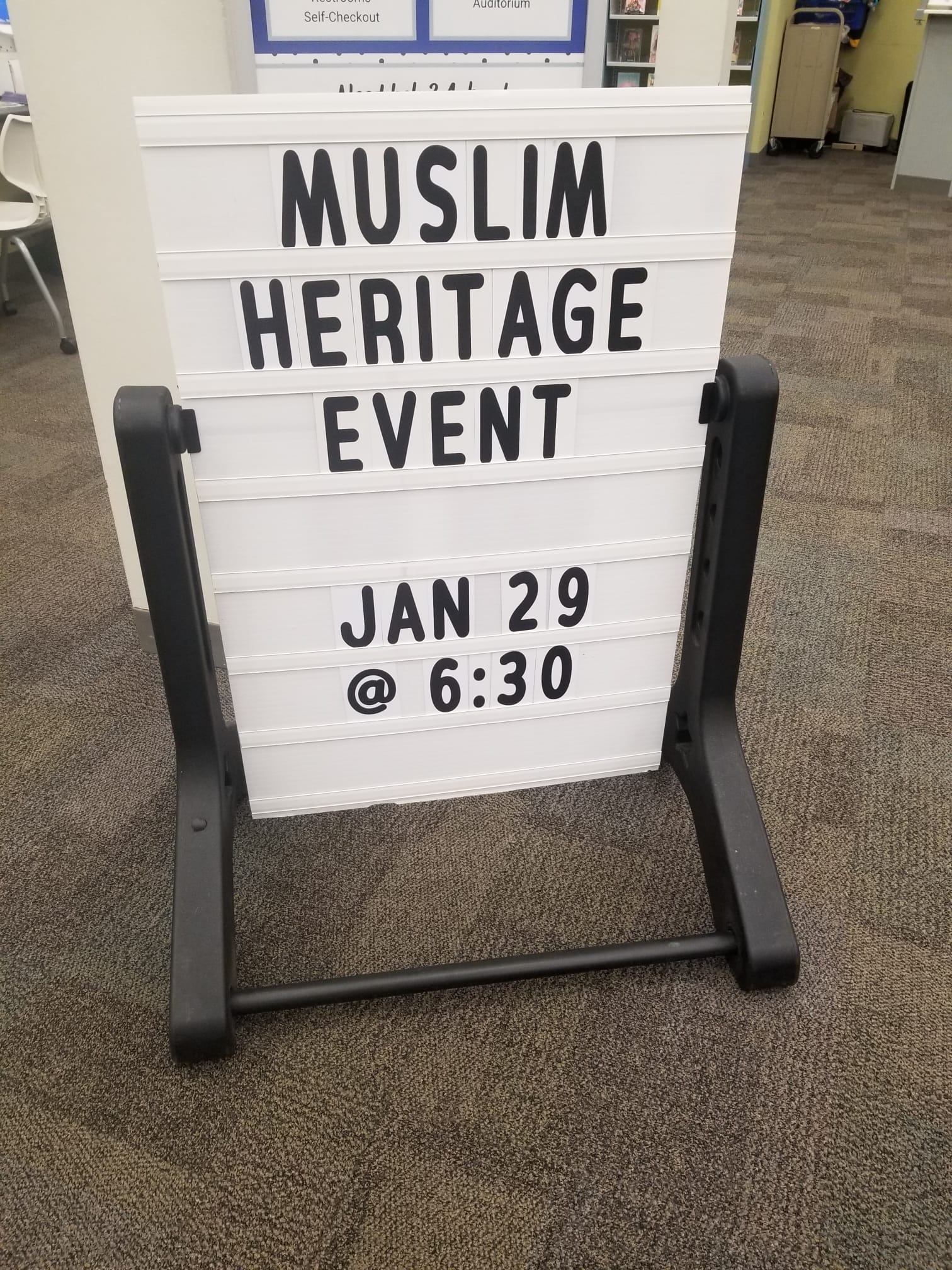 Daisy Khan speaking passionately at a community event, inspiring civic engagement and unity.