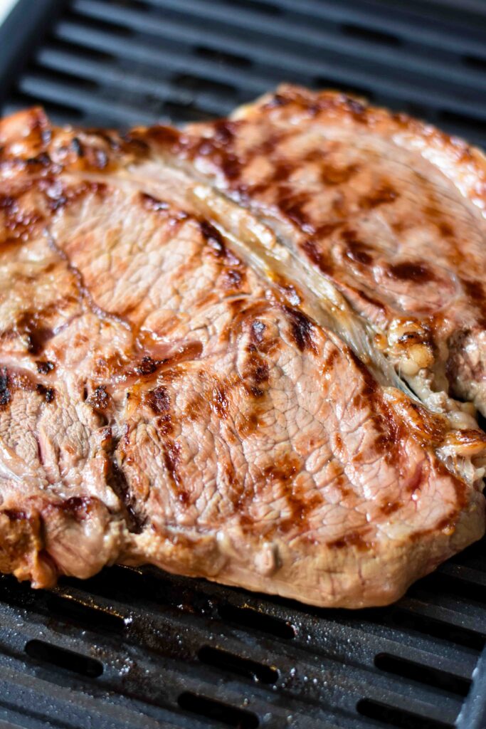 Grilled steak on the grill.