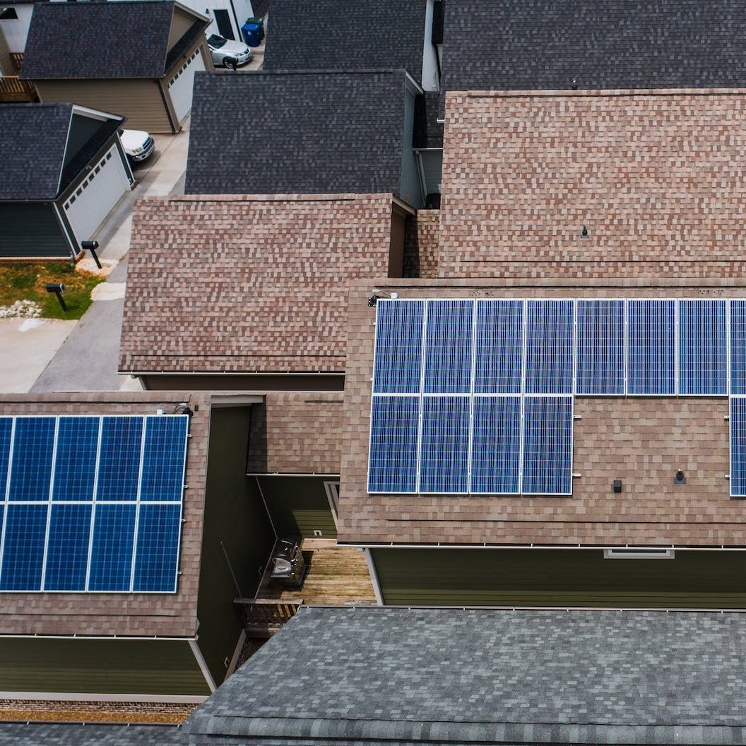 solar panels on tiled roofs of a house