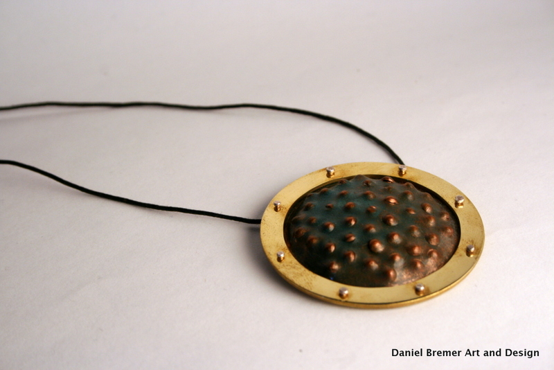 Framed texture pendant; copper, brass, sterling silver
