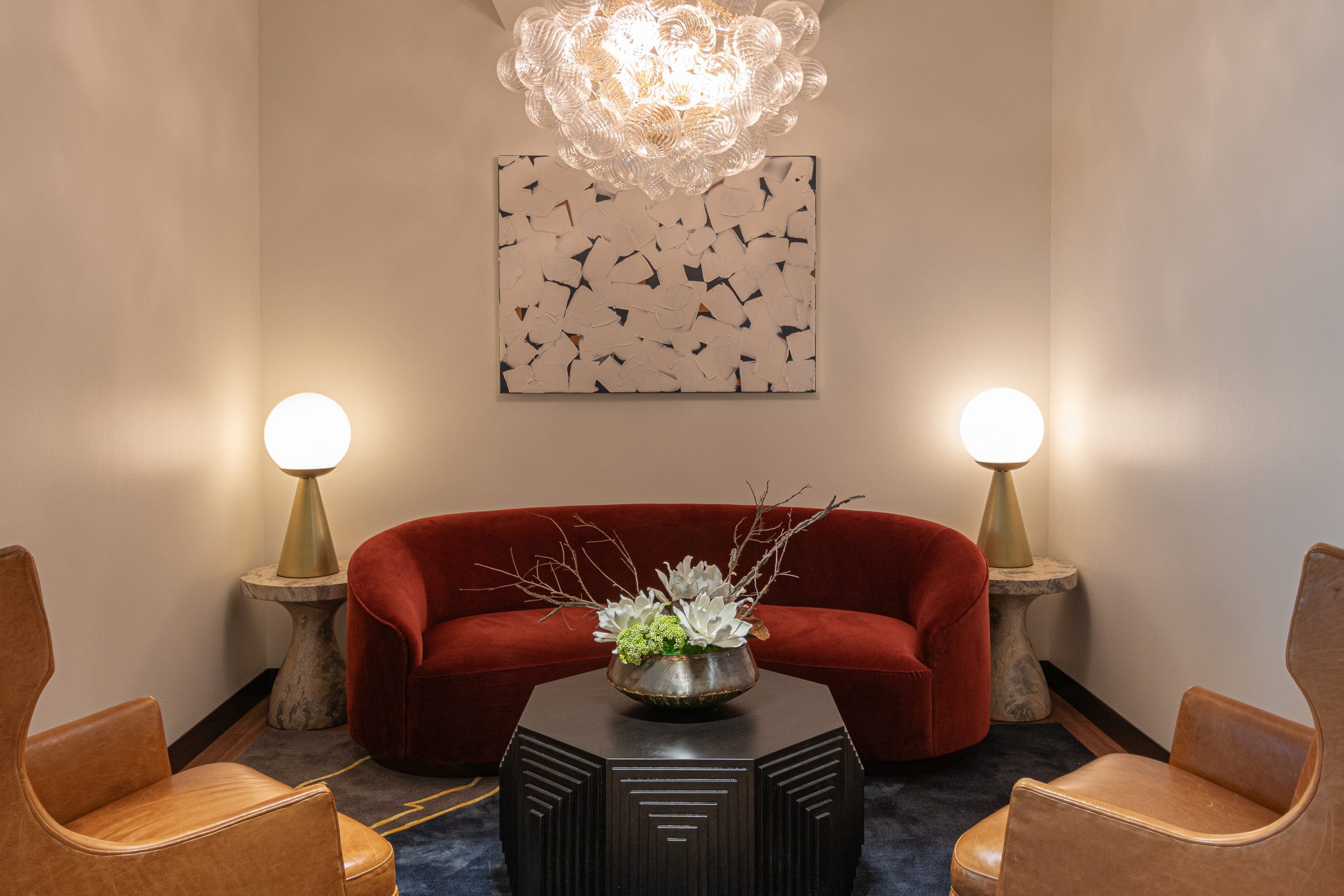 Elegant living room with red sofa and modern art