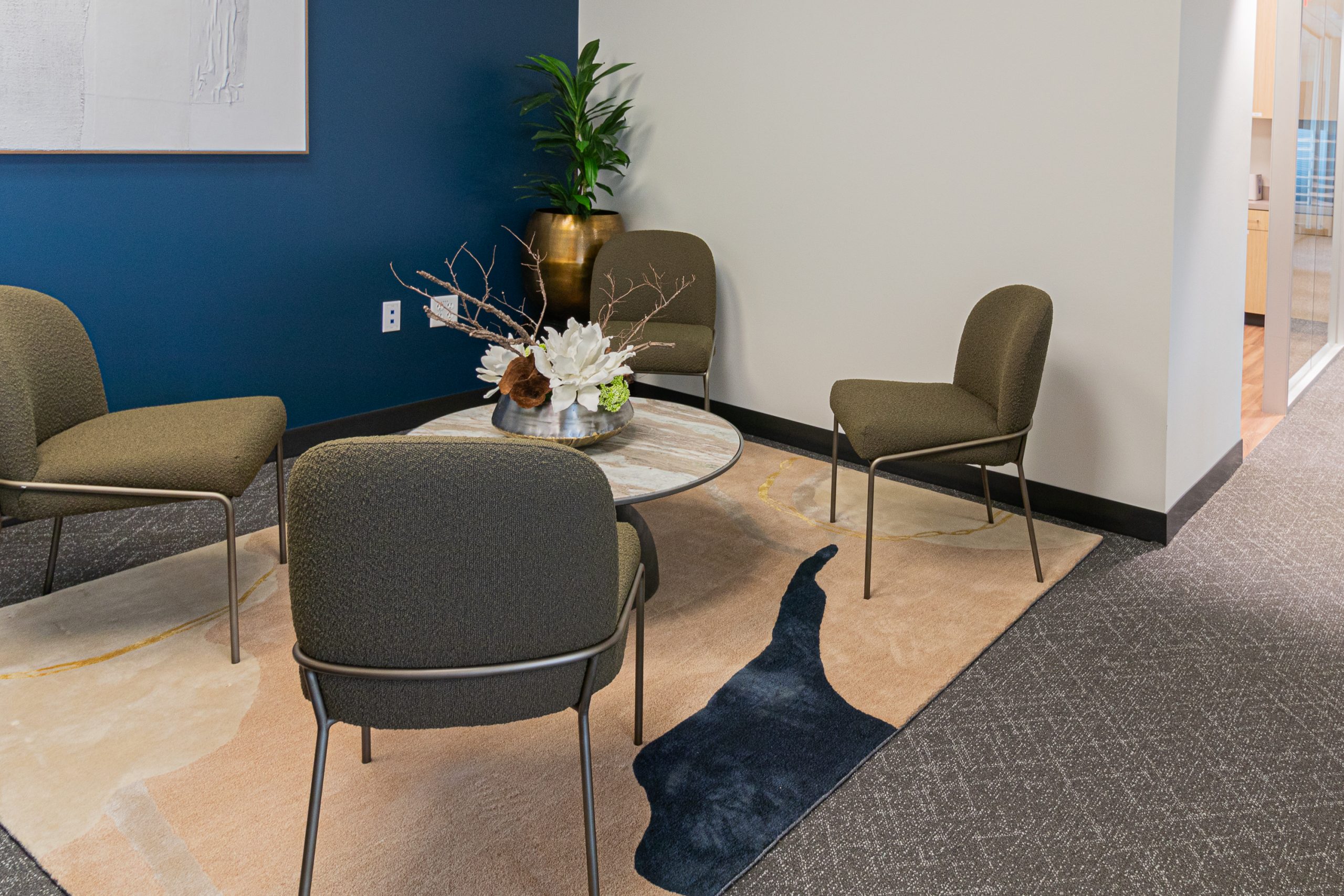 Modern office waiting area with chairs and plants