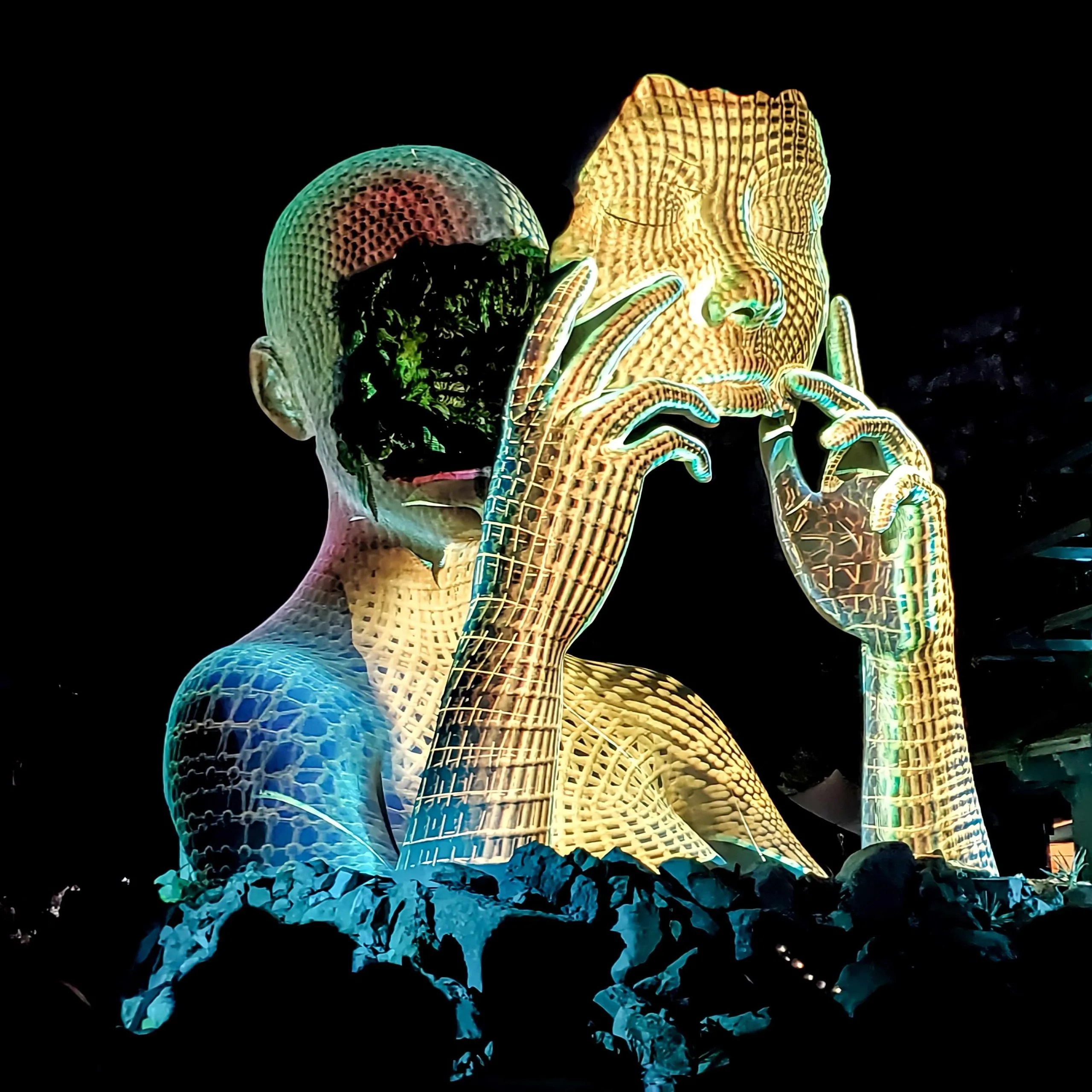 Monumental woman holding her face like a mask under projection mapping in Modem Swamp by Daniel Popper at Mo:Dem Festival in Croatia
