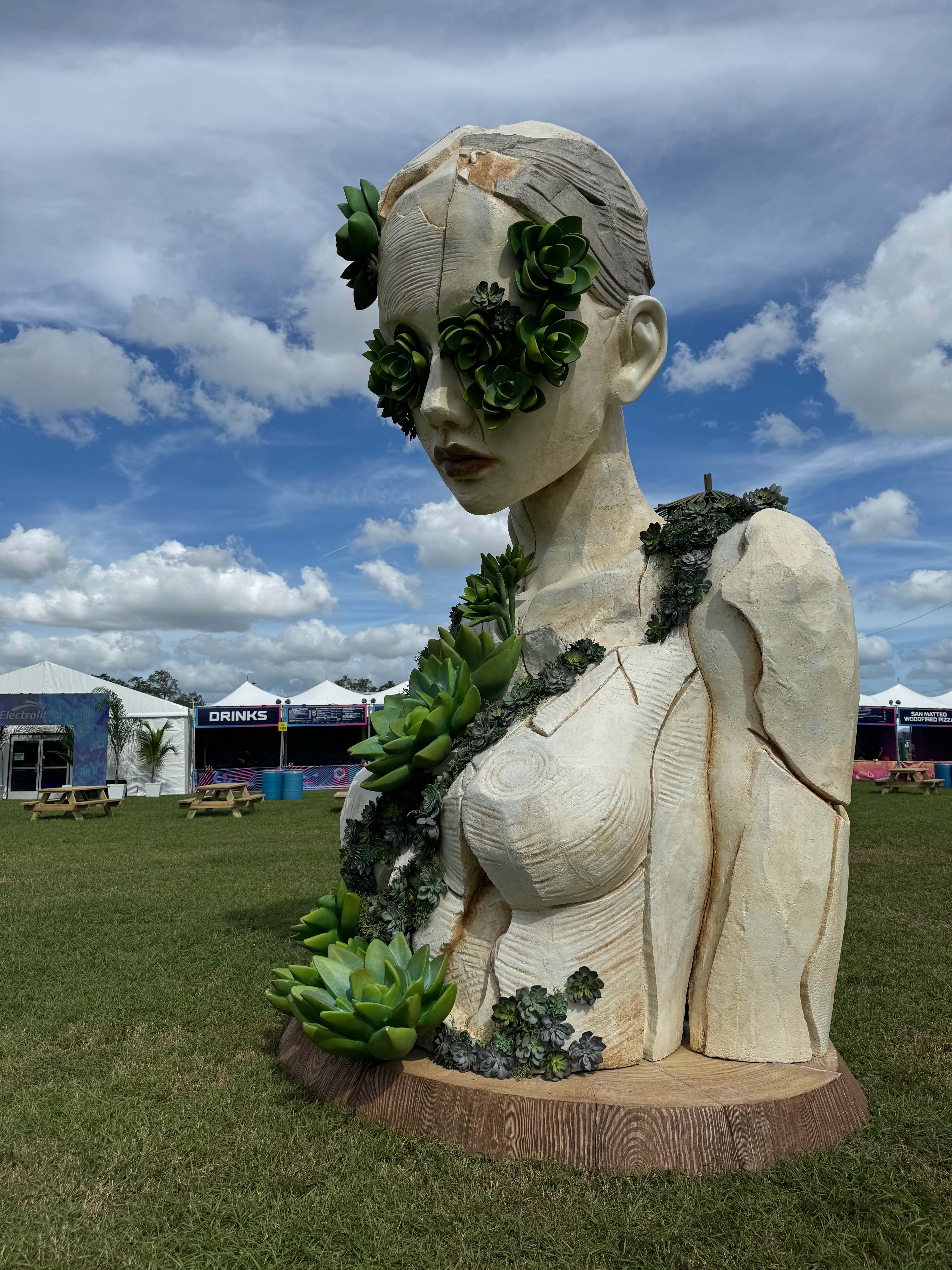 Female figure covered with oversized succulent rosettes in Aeonium by Daniel Popper at EDC Orlando, Florida