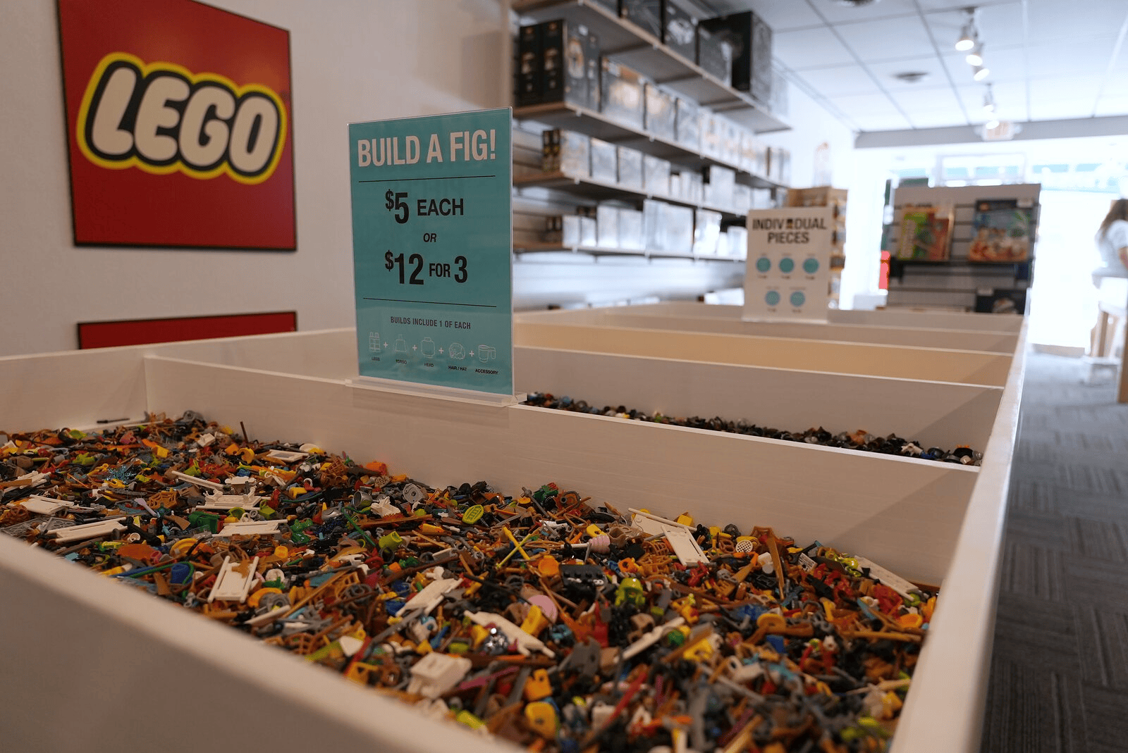 Minifigure parts and the Build a Fig sign at Dapper Bricks
