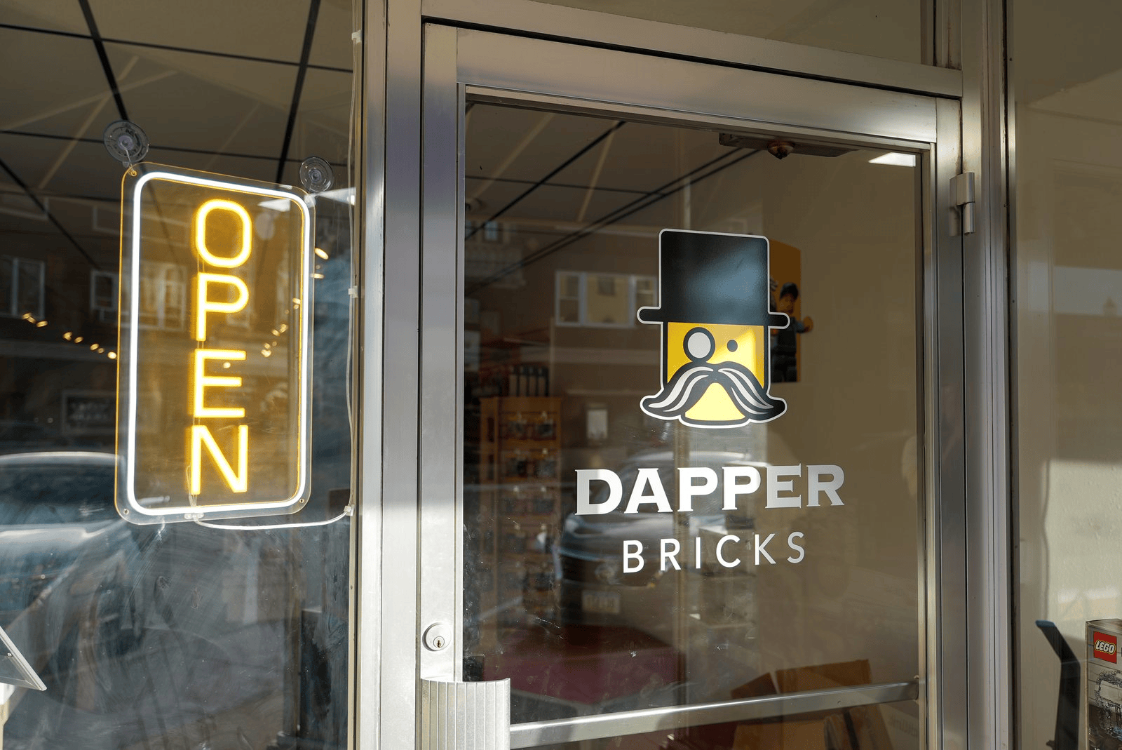 Dapper Bricks logo on the glass entrance door