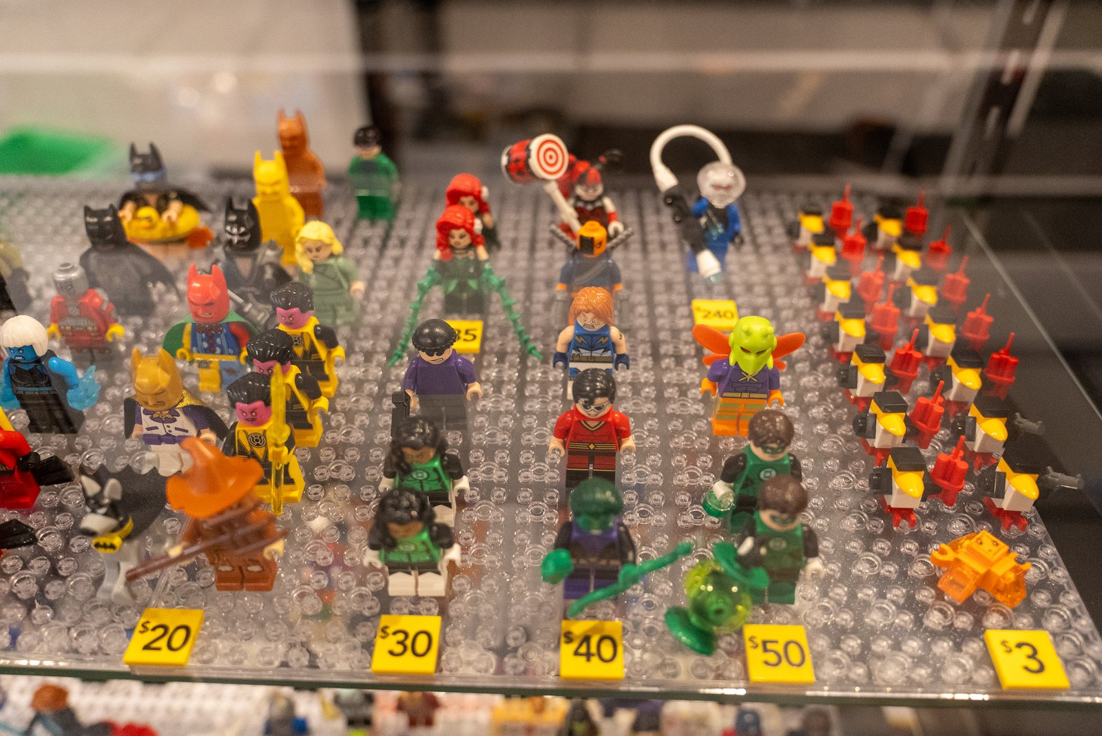 LEGO minifigures arranged in the store display case