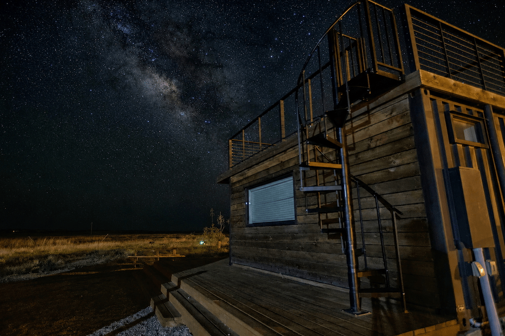Riata Inn container with Milky Way background
