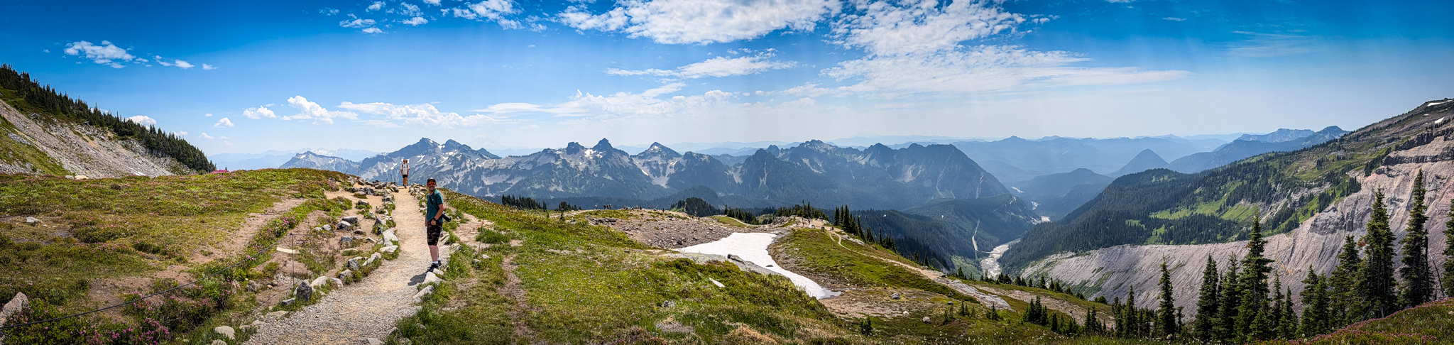 A hiker following the Skyline Trail through an open alpine landscape