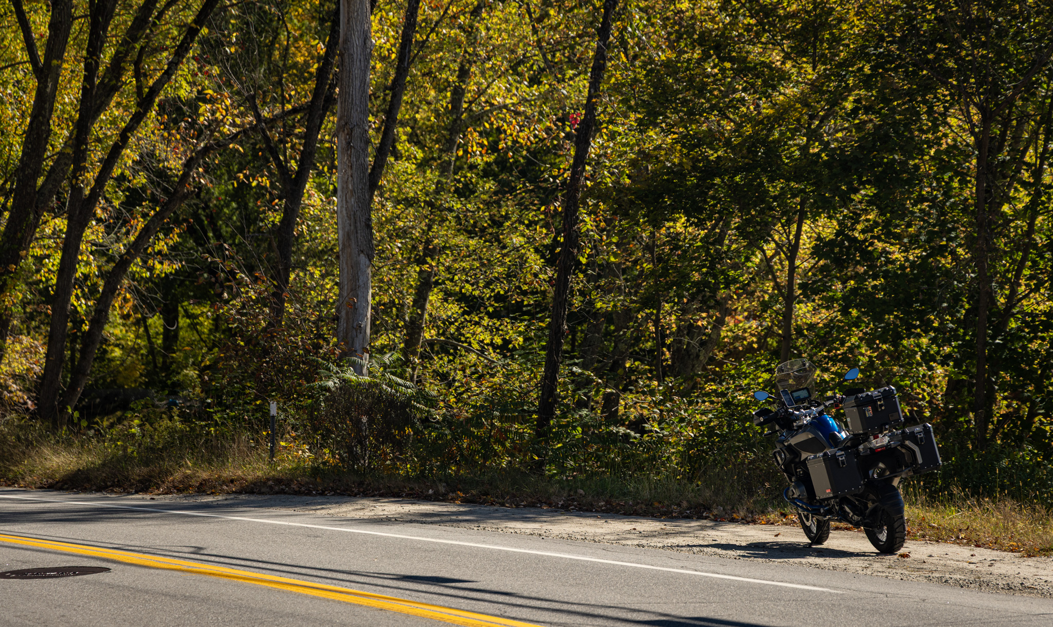 The GS parked along a shaded country road
