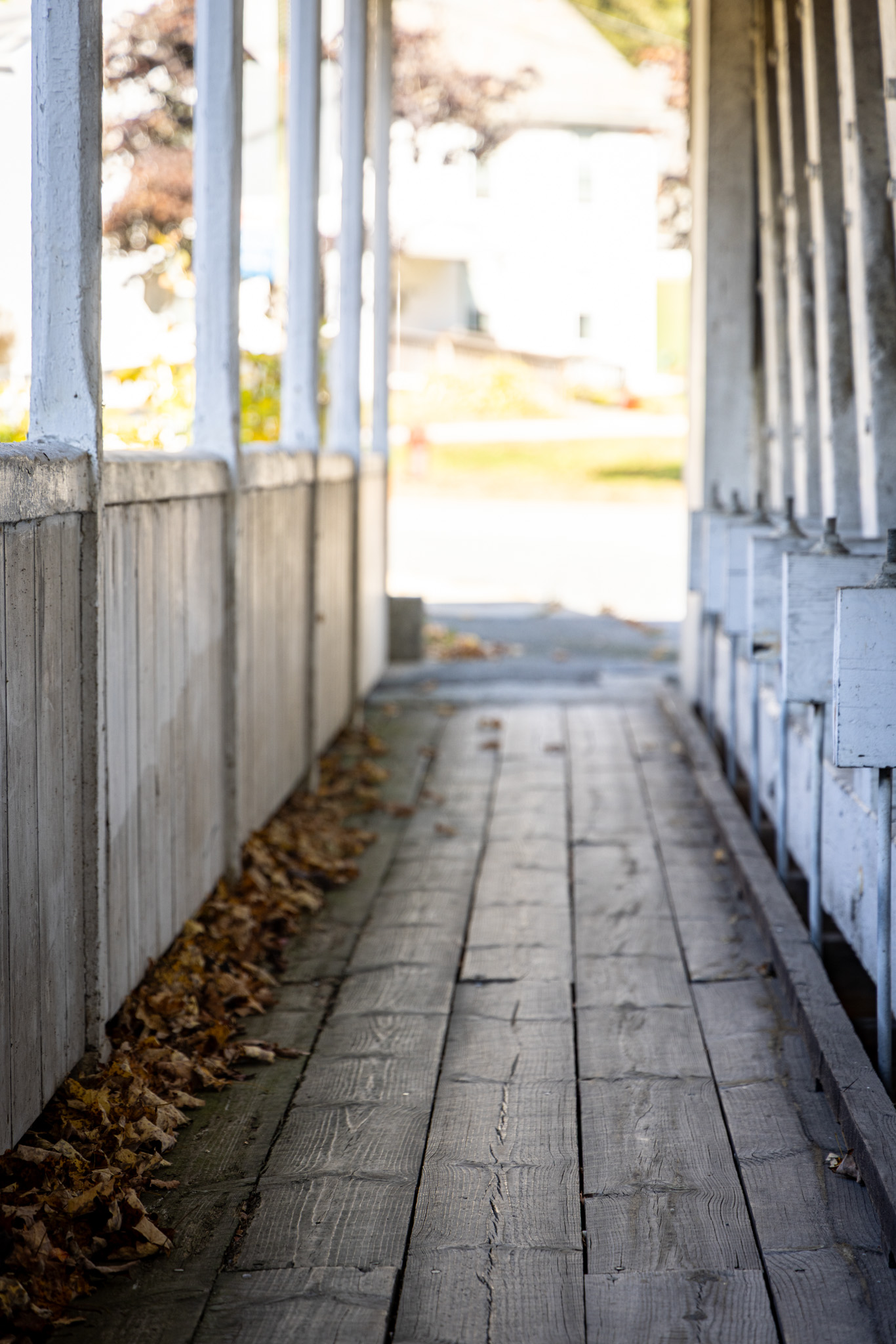 Wooden walkway along the side of a covered bridge