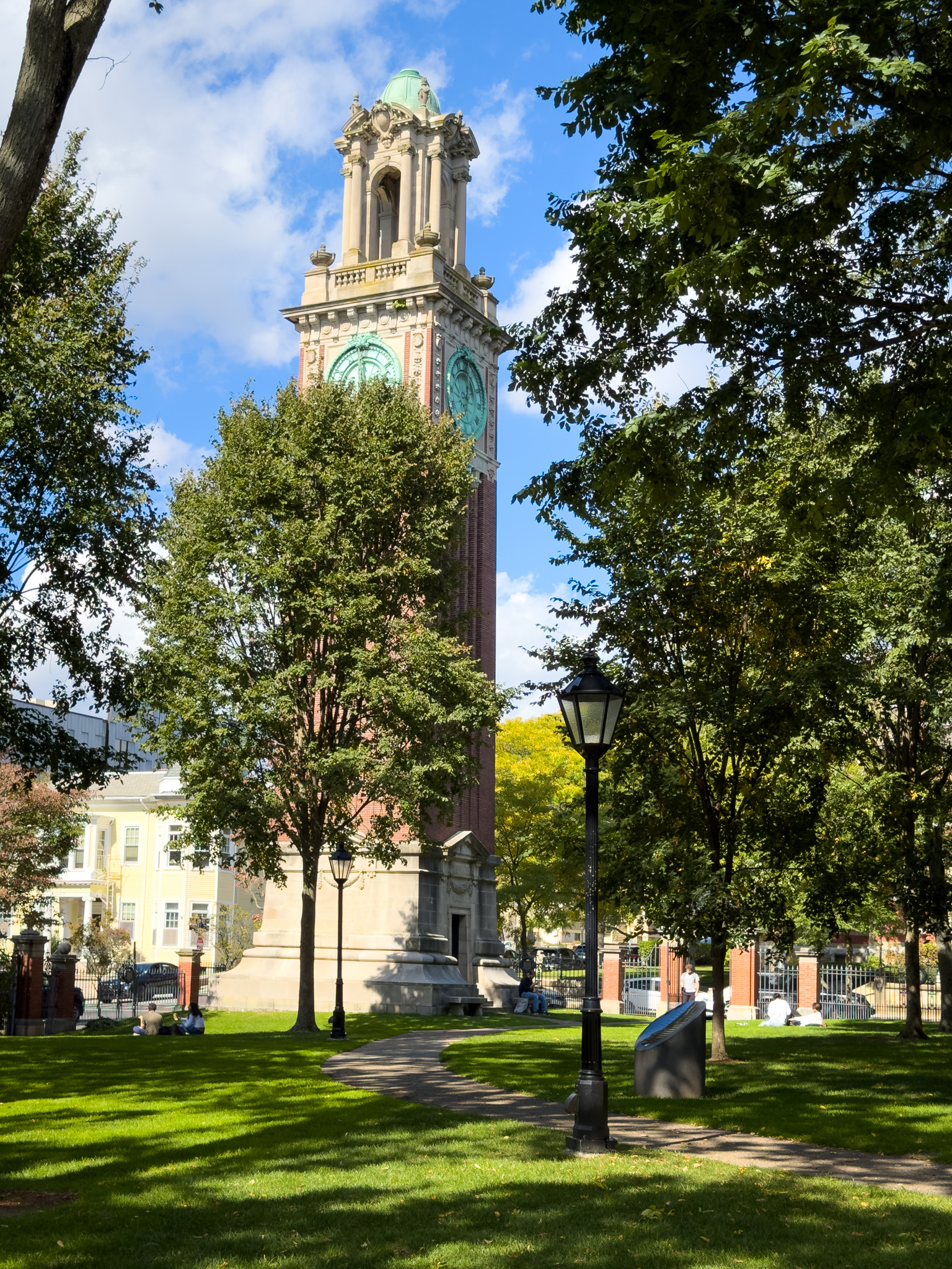 Clock tower rising above the trees at Brown
