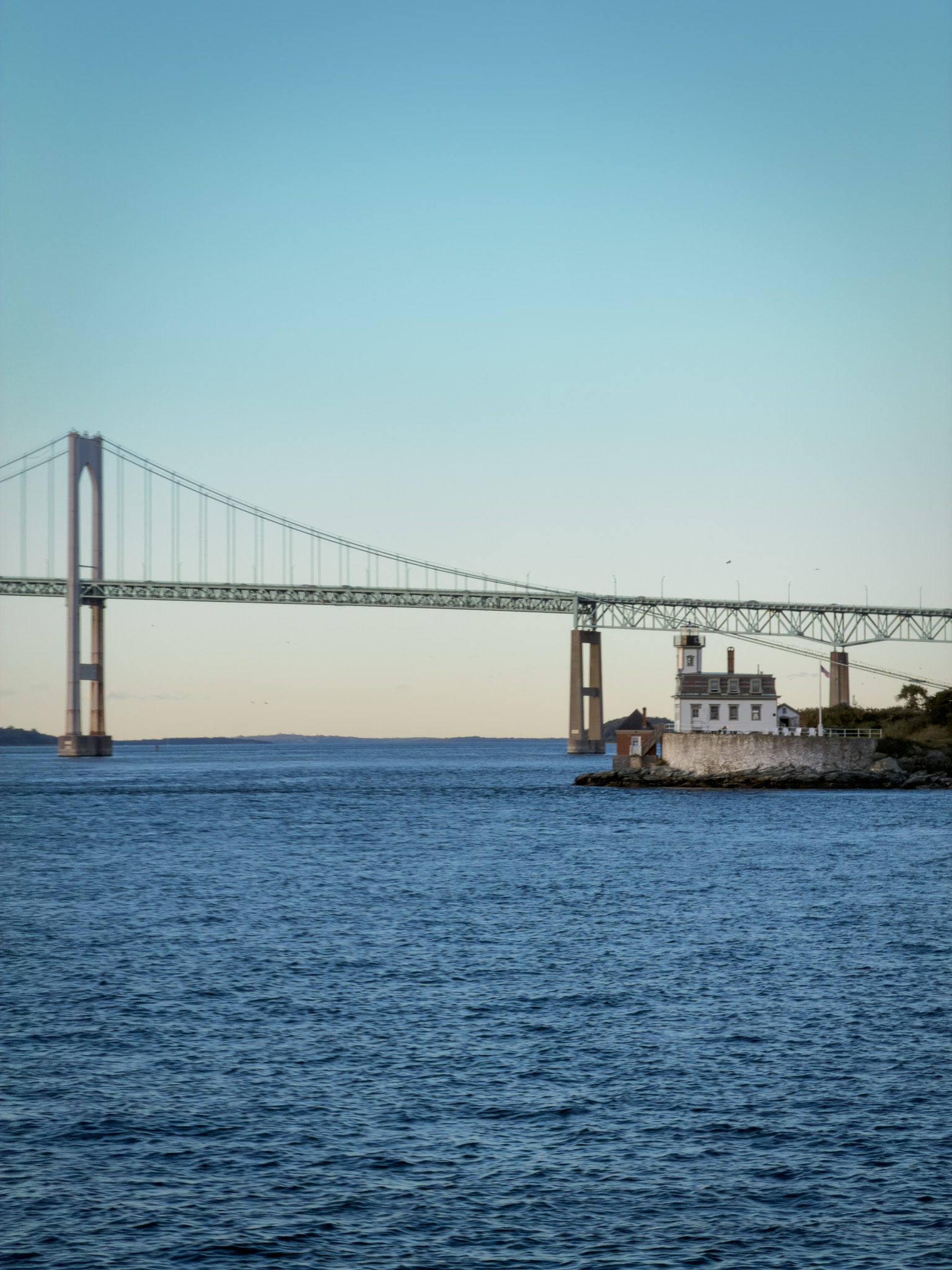 The Newport Bridge with a small lighthouse below it