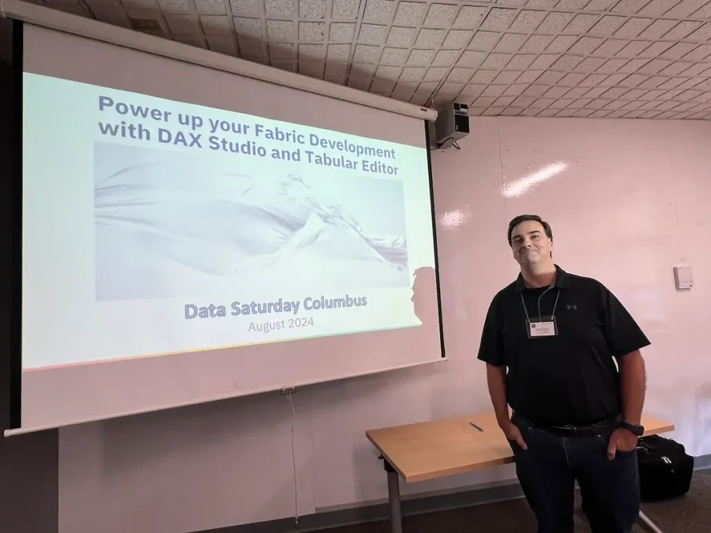Jason Romans standing in front of slide titled Power up your Fabric Development with DAX Studio and Tabular Editor