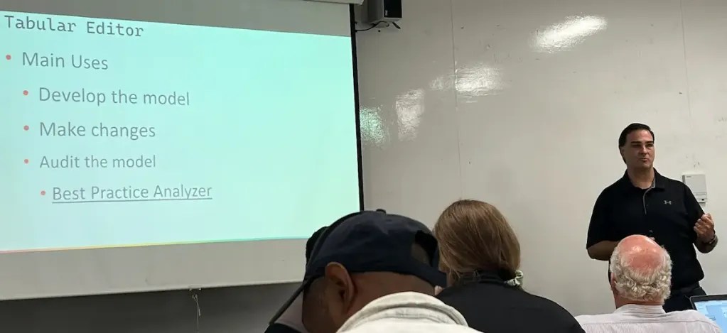 Jason Romans presenting next to a slide titled Tabular Editor with Main Uses, Develop the Model, Make Changes, Audit the model, and best Practice Analyzer