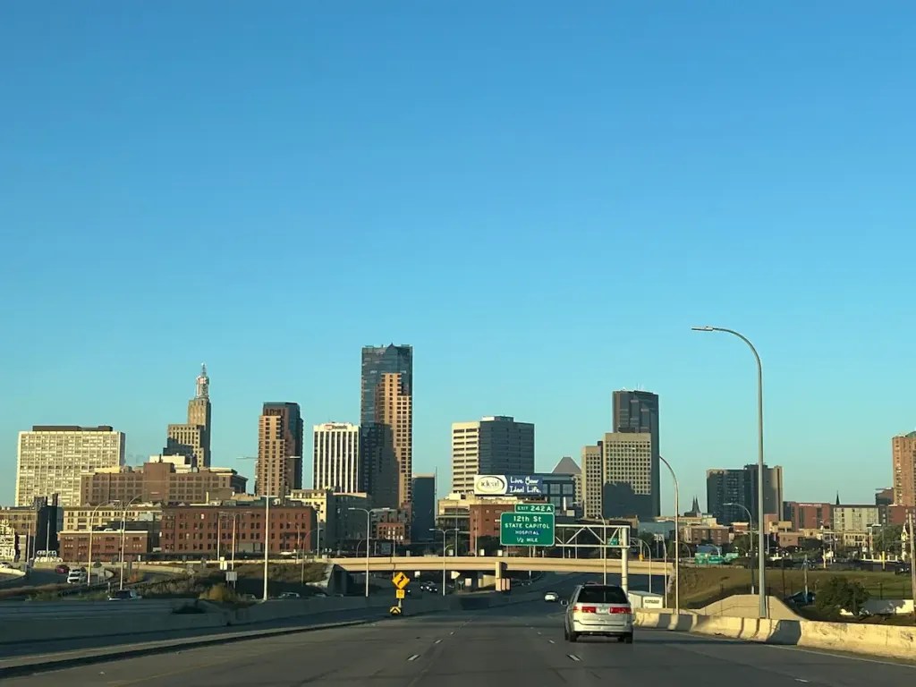 Downtown Minneapolis skyline with tall buildings and clear blue sky.