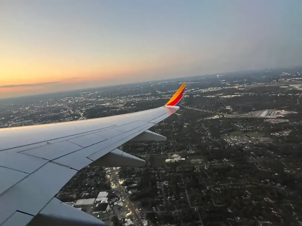 Southwest plane wing with landscape below