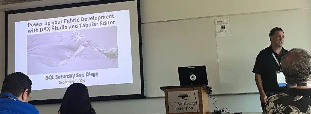 Jason Romans presenting with slide on screen showing Power up your Fabric Development with DAX Studio and Tabular Editor - SQL Saturday San Diego September 2024
