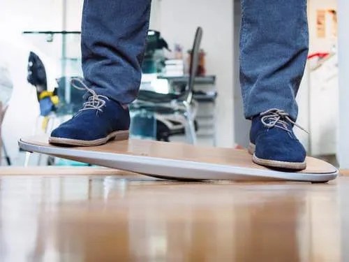 A photo of someone's feet and lower legs standing on The Level.