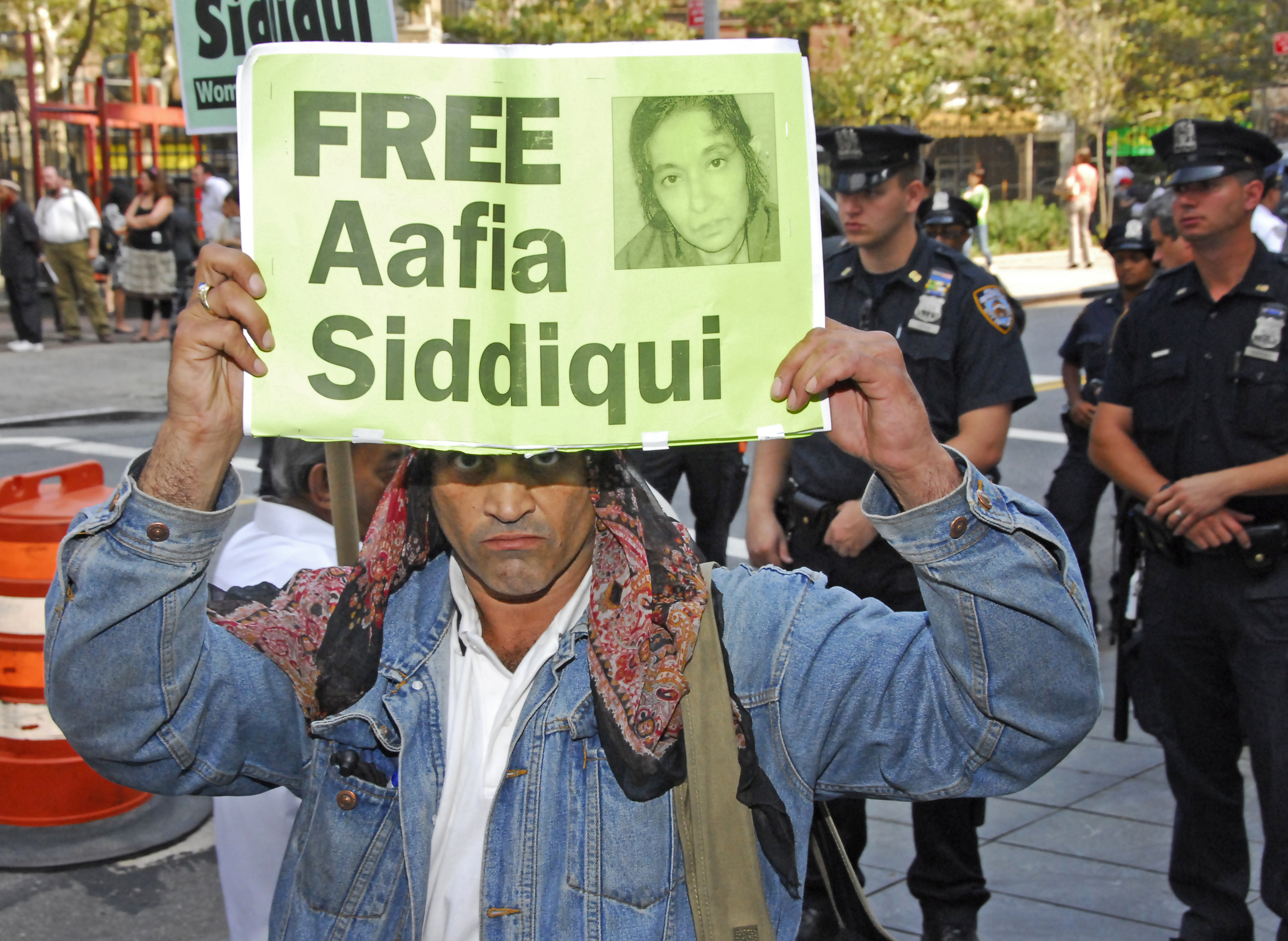 Protester holding sign at Aafia Siddiqui sentencing at US District Court, 500 Pearl, NYC.