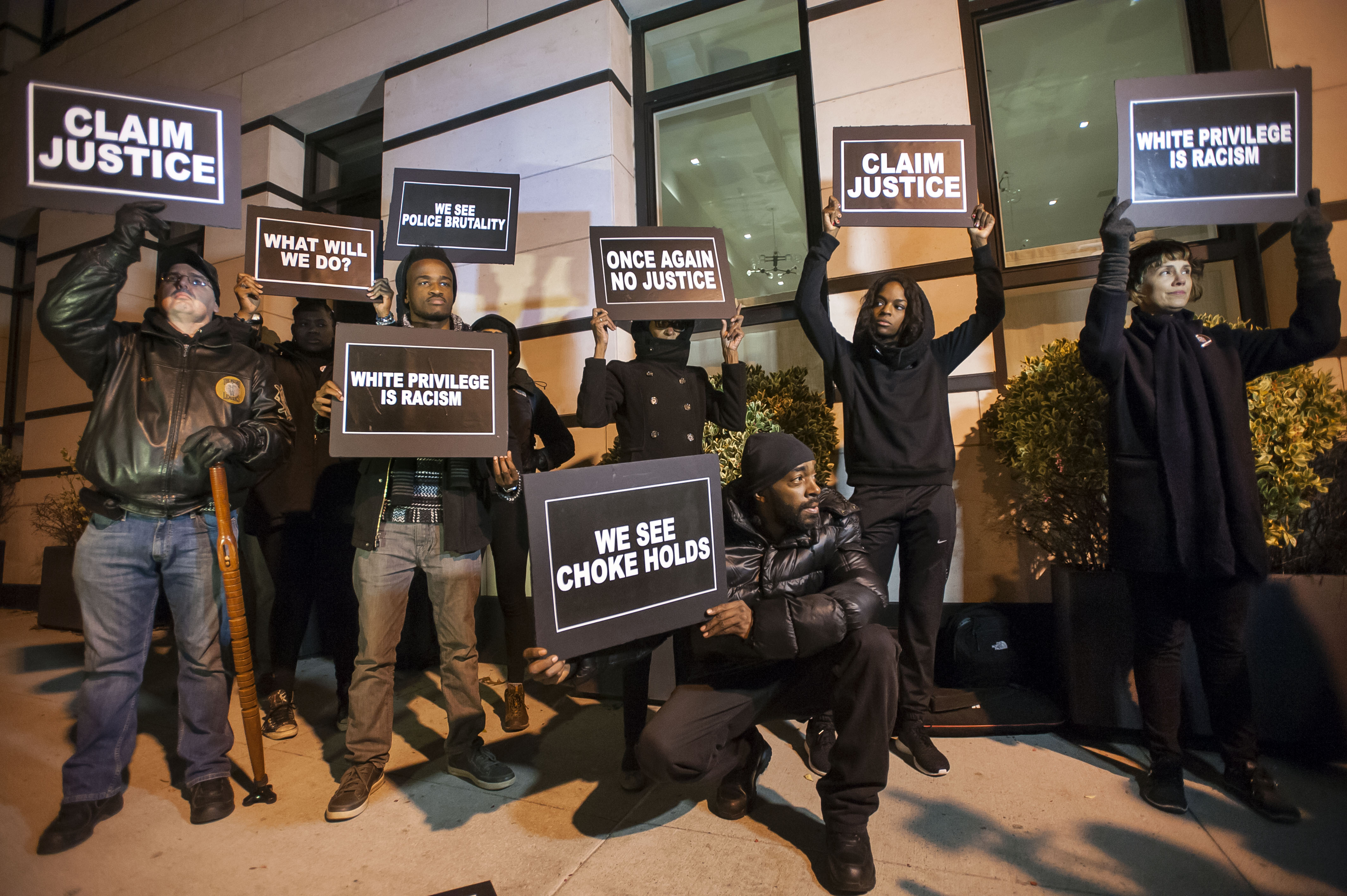 Group protesting across from Gracie Mansion at 1 year anniversary of non-indictment of officer responsible for choke hold death of Eric Garner