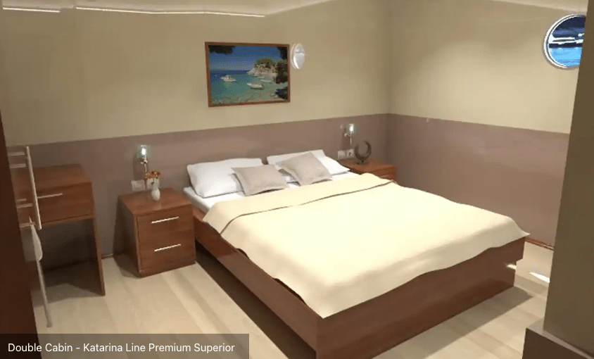 Double berth room with porthole and nightstands
