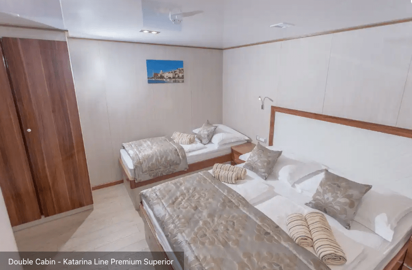 Cabin bedroom with double and single beds