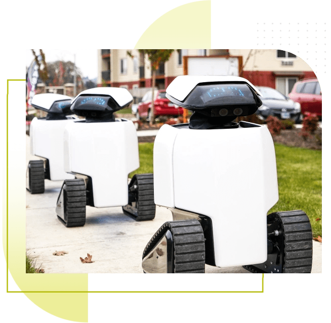 three dax robots going down a sidewalk