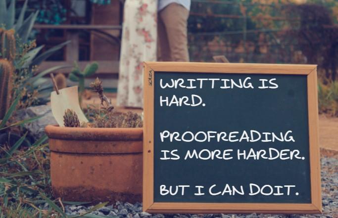 A picture of a small chalkboard that contains several typos and spelling mistakes, indicating that proofreading is tricky