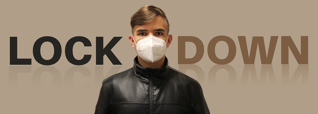 I young man wearing a mask, standing between the words lock and down. Introduces how desperately the Seoul government could've used an English copywriting or English proofreading service before they published their new Level 4 COVD-19 guidelines