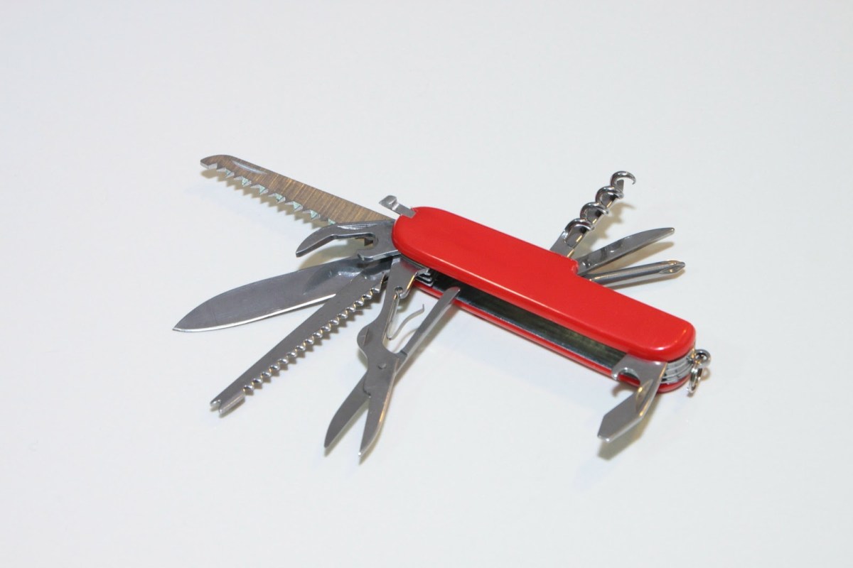 A picture of a Swiss army knife with all the attachments open.