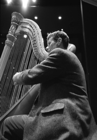 Darryl Coan playing harp