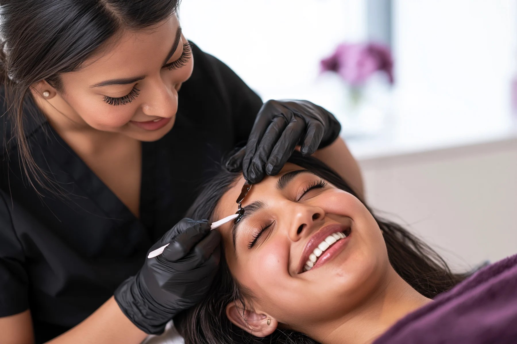 Esthetics student performing eyebrow waxing (illustrative)