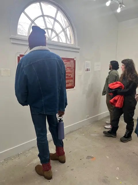 Open studios at Ragdale. Deborah Scott's studio with fellow residents looking at her painting on the wall