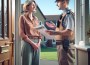"Woman calmly talking to bailiff at the door"